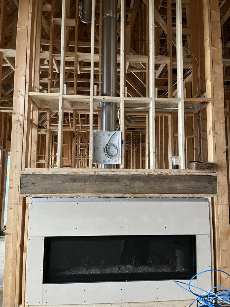 tv box installed above a fireplace