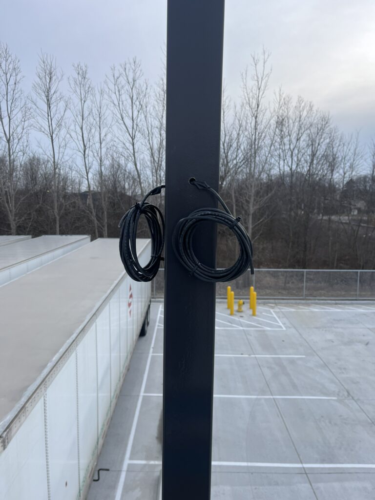 Wires ran thru a Light Pole for cameras to watch a parking lot